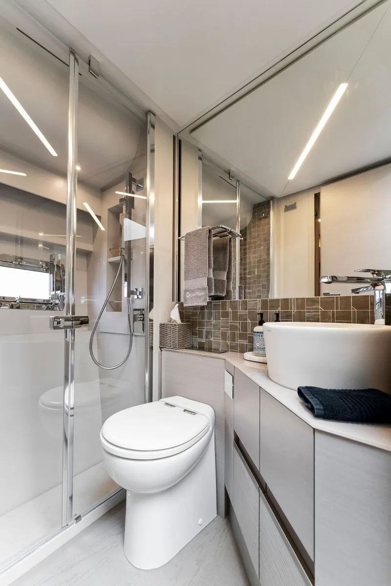 Slide: The Image of Modern bathroom in 2022 Pershing 7X yacht with sleek design and glass shower. - 39