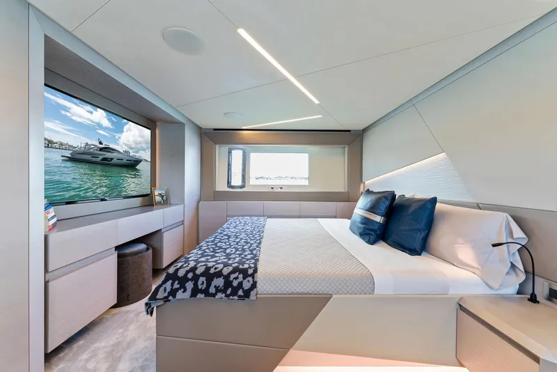 Slide: The Image of Luxurious bedroom interior of 2022 Pershing 7X yacht with modern design and large window view. - 40