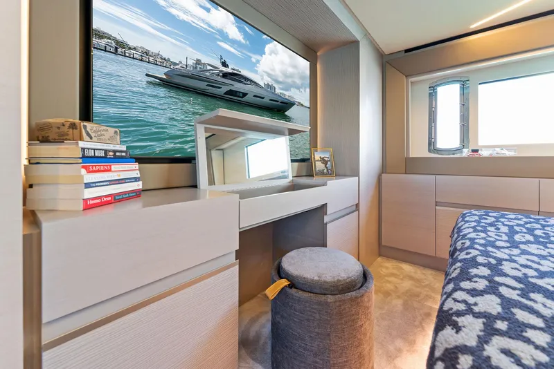 Slide: The Image of Luxurious interior of 2022 Pershing 7X yacht with modern decor and scenic window view. - 43