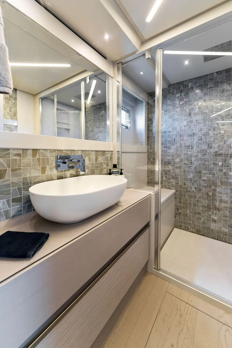 Slide: The Image of Luxurious bathroom in 2022 Pershing 7X yacht with modern fixtures and elegant design. - 44