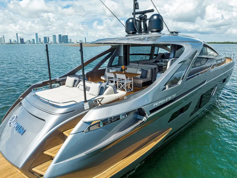 Slide: The Image of Luxury 2022 Pershing 7X yacht on water with city skyline in background. - 5