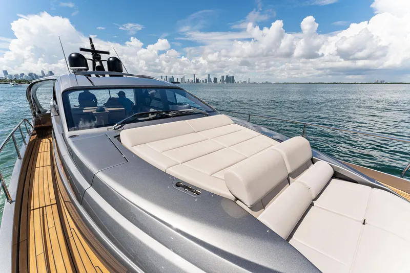 Slide: The Image of 2022 Pershing 7X luxury yacht on open water with city skyline. - 7