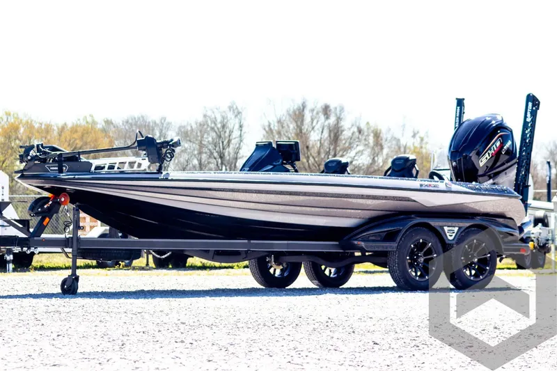 Slide: The Image of 2025 Skeeter FXR 21 Limited boat on trailer, side view, outdoors. - 1