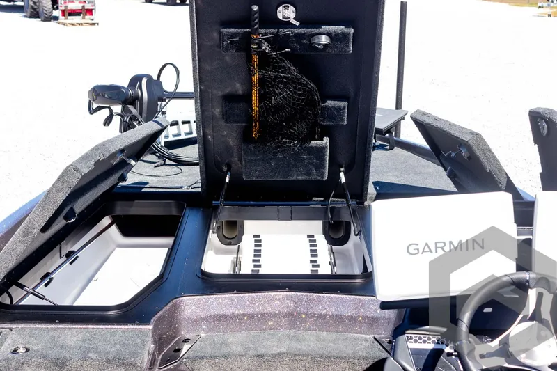 Slide: The Image of 2025 Skeeter FXR 21 Limited boat interior with storage compartments and Garmin equipment. - 27