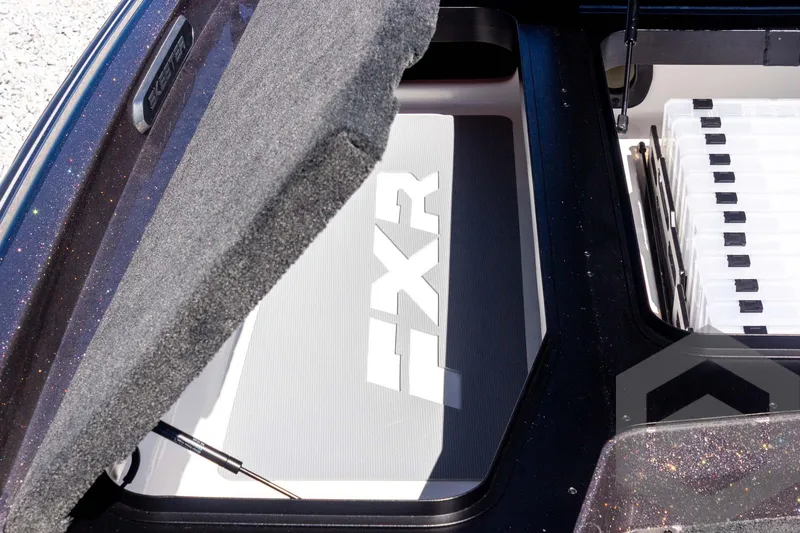 Slide: The Image of 2025 Skeeter FXR 21 Limited storage compartment with FXR branding. - 28