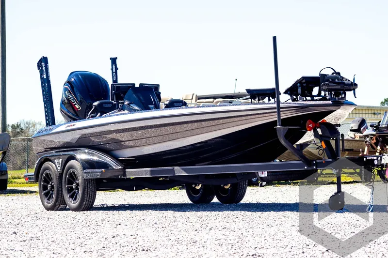Slide: The Image of 2025 Skeeter FXR 21 Limited boat on trailer, parked outdoors. - 3