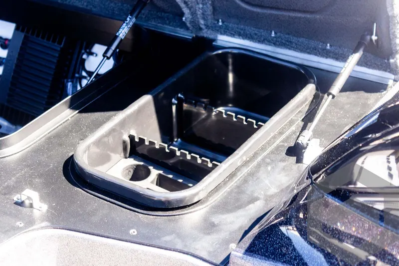 Slide: The Image of 2025 Skeeter FXR 21 Limited boat storage compartment, open and empty. - 31