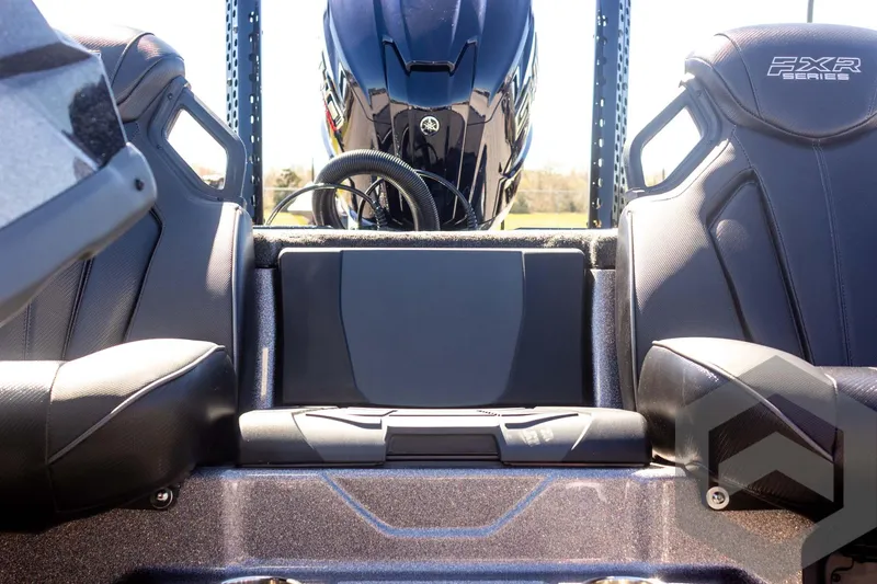 Slide: The Image of 2025 Skeeter FXR 21 Limited boat interior with dual seats and engine view. - 38