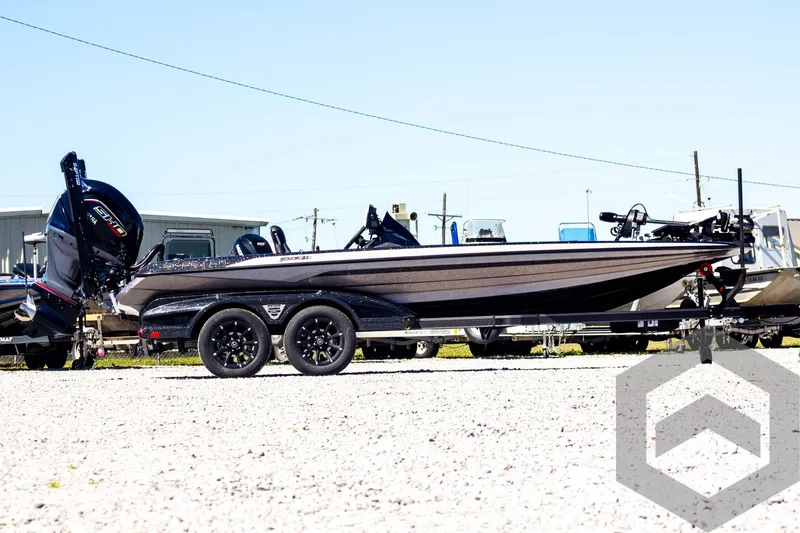 Slide: The Image of 2025 Skeeter FXR 21 Limited boat on trailer, parked outdoors. - 4