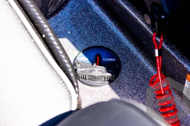 Slide: The Image of 2025 Skeeter FXR 21 Limited boat control panel with closed switch and red safety cord. - 42