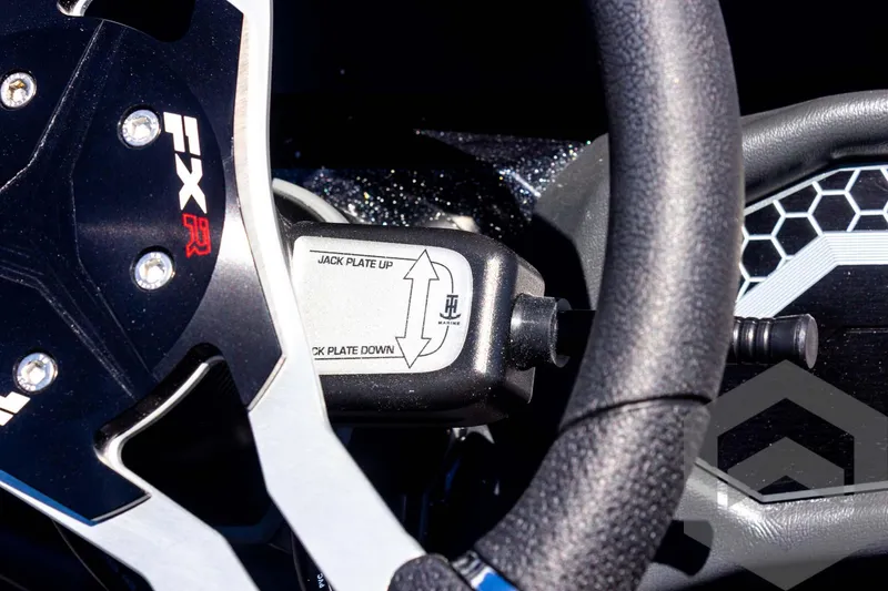 Slide: The Image of 2025 Skeeter FXR 21 Limited steering wheel with jack plate control. - 44
