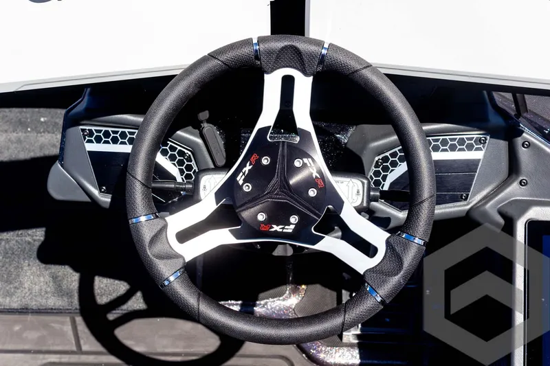 Slide: The Image of Steering wheel of 2025 Skeeter FXR 21 Limited boat, featuring modern design and controls. - 45