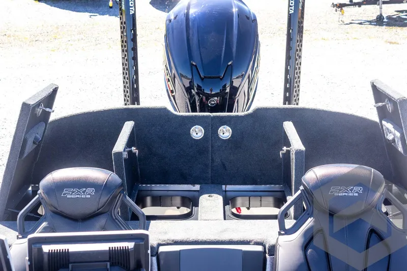 Slide: The Image of 2025 Skeeter FXR 21 Limited boat interior with dual seats and motor view. - 46