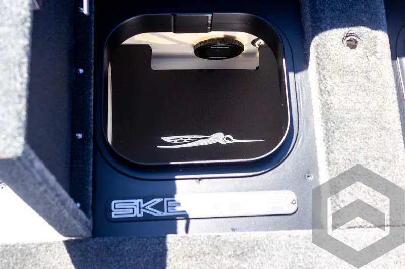 Slide: The Image of 2025 Skeeter FXR 21 Limited boat interior storage compartment with logo detail. - 47