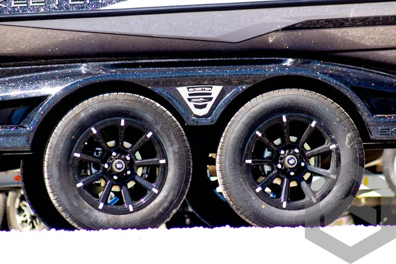 Slide: The Image of Trailer wheels of 2025 Skeeter FXR 21 Limited boat, close-up view. - 5