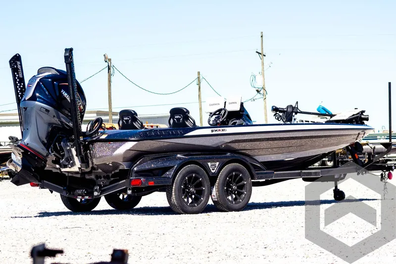 Slide: The Image of 2025 Skeeter FXR 21 Limited boat on trailer, side view, outdoors. - 6