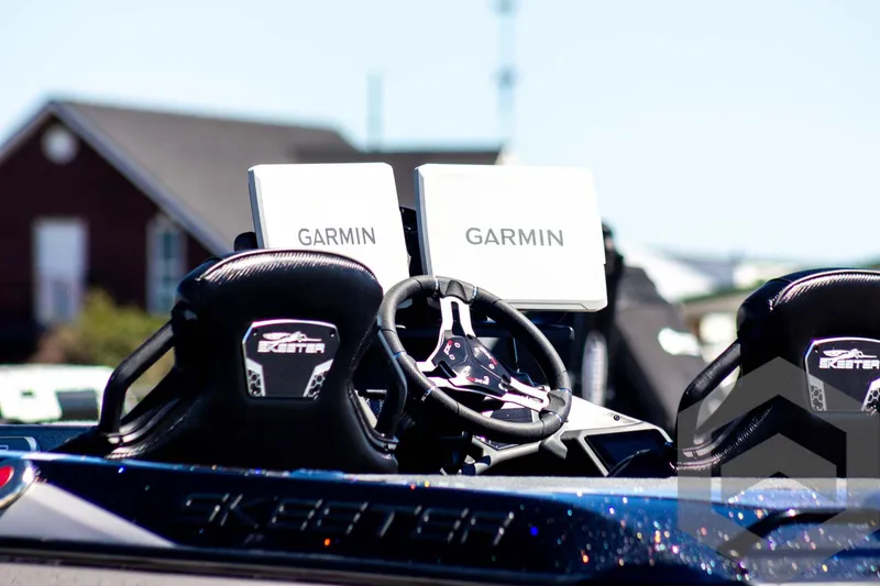 Slide: The Image of 2025 Skeeter FXR 21 Limited boat with dual Garmin displays and sleek interior design. - 8