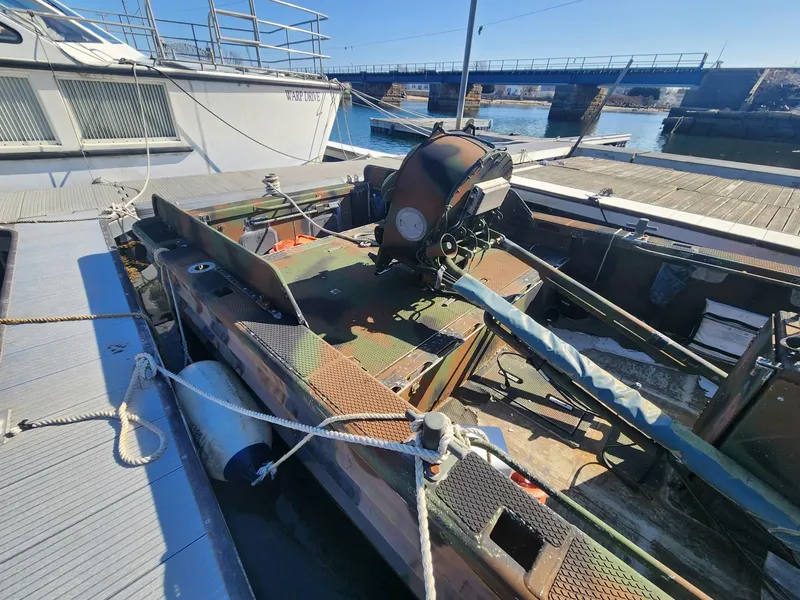 Slide: The Image of 1999 Recon SWCC Special Operations Vessel docked, showcasing military design and equipment. - 4