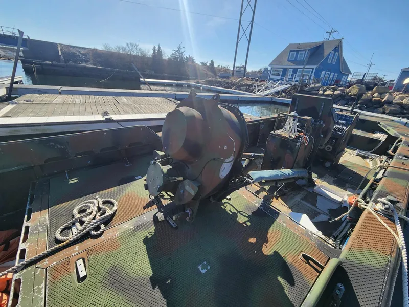 Slide: The Image of 1999 Recon SWCC Special Operations Vessel docked, showcasing equipment and camouflage design. - 5