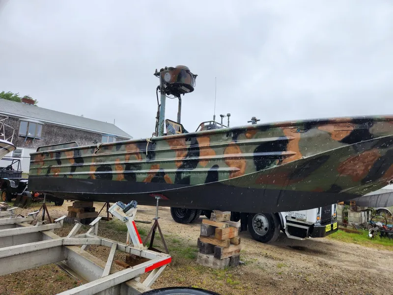 Slide: The Image of Camouflaged 1999 Recon SWCC Special Operations Vessel on land, showcasing military design. - 7