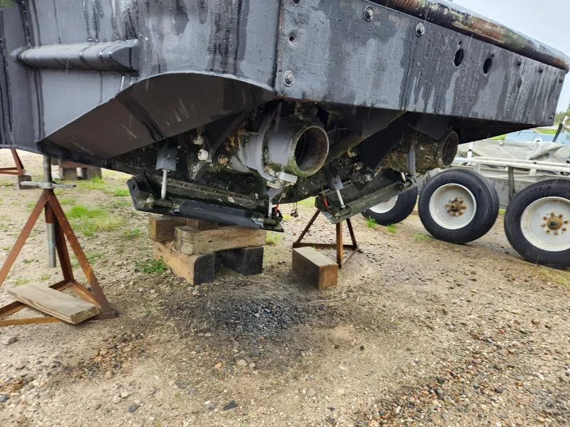 Slide: The Image of 1999 Recon SWCC Special Operations Vessel on stands, showing underside and propulsion system. - 8