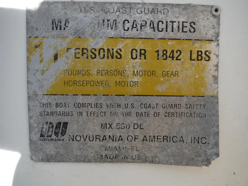Slide: The Image of Novurania MX 530 DL 2000 capacity plate, 11 persons or 1842 lbs, U.S. Coast Guard compliant. - 10