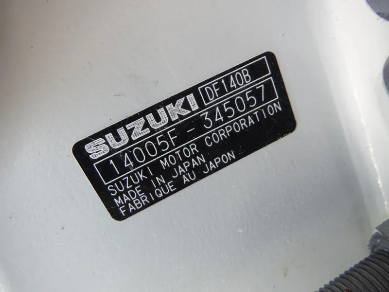 Slide: The Image of Label on Suzuki motor, model DF140B, made in Japan, on Novurania MX 530 DL, 2000. - 11