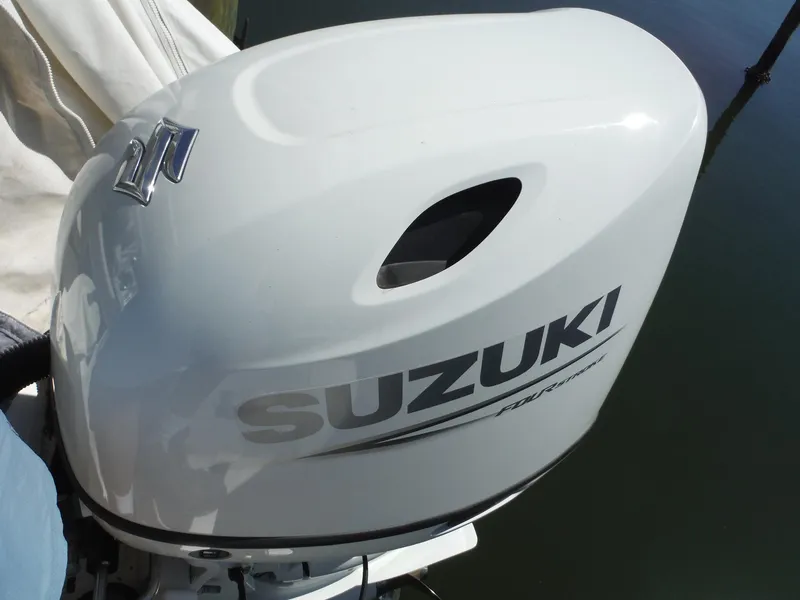Slide: The Image of Suzuki outboard motor on a 2000 Novurania MX 530 DL boat. - 12