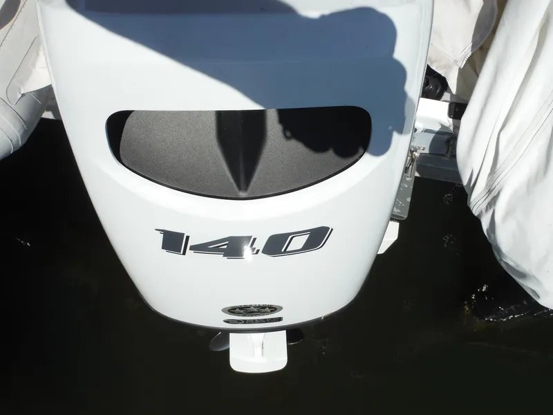 Slide: The Image of Outboard motor on a 2000 Novurania MX 530 DL boat, displaying "140" horsepower. - 13