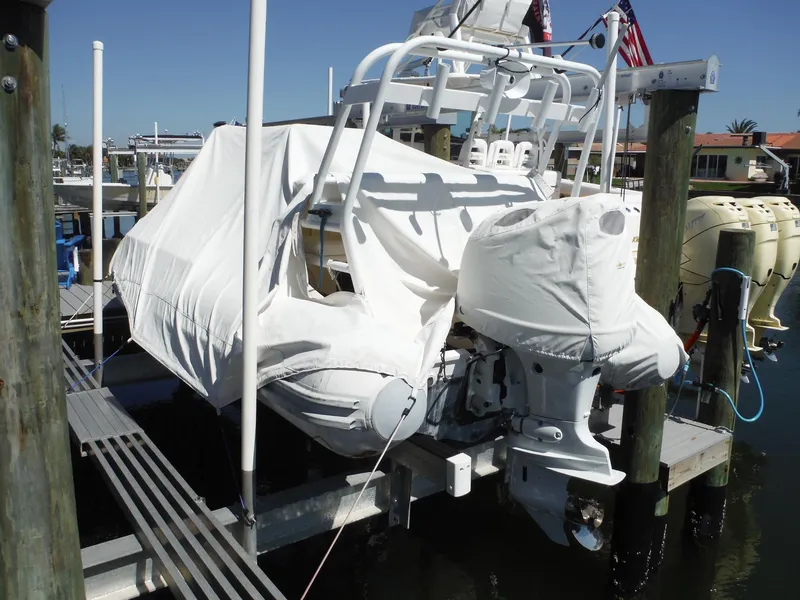 Slide: The Image of Covered 2000 Novurania MX 530 DL boat docked at marina. - 2