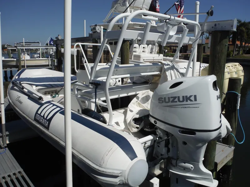 Slide: The Image of Novurania MX 530 DL 2000 boat with Suzuki outboard motor docked at marina. - 3