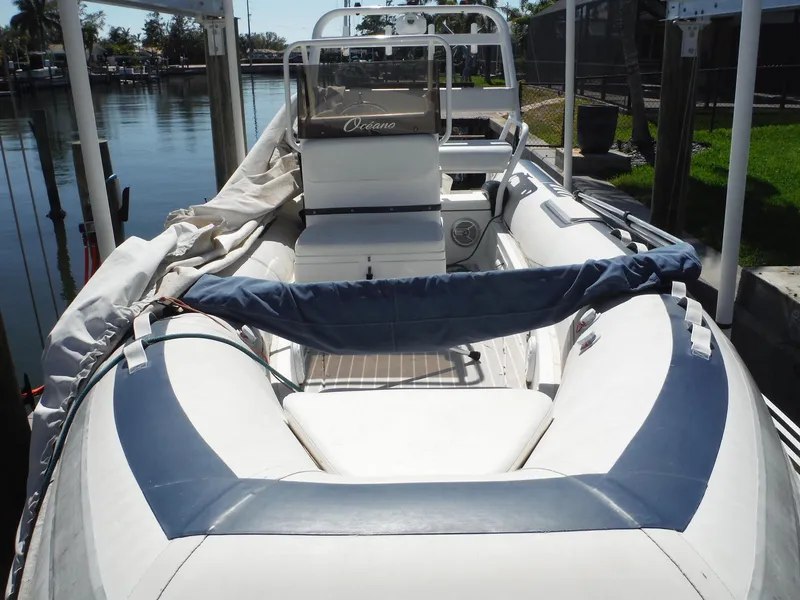 Slide: The Image of Novurania MX 530 DL 2000 inflatable boat docked by the water. - 6