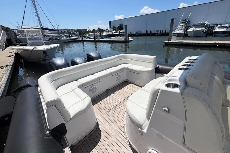 Slide: The Image of 2013 Yellowfin 40 boat with spacious seating at a marina dock. - 8