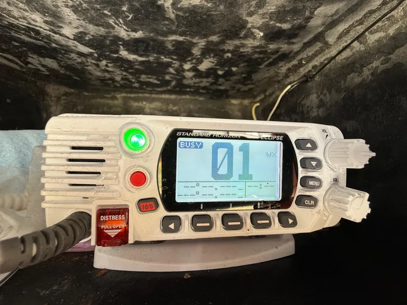 Slide: The Image of Marine radio on 2020 Sea Fox 206 Commander, displaying channel 01 with distress button. - 11