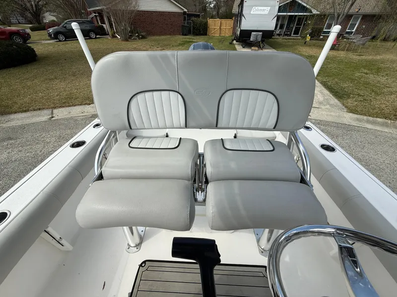 Slide: The Image of 2020 Sea Fox 206 Commander boat seats with gray upholstery in a residential area. - 12