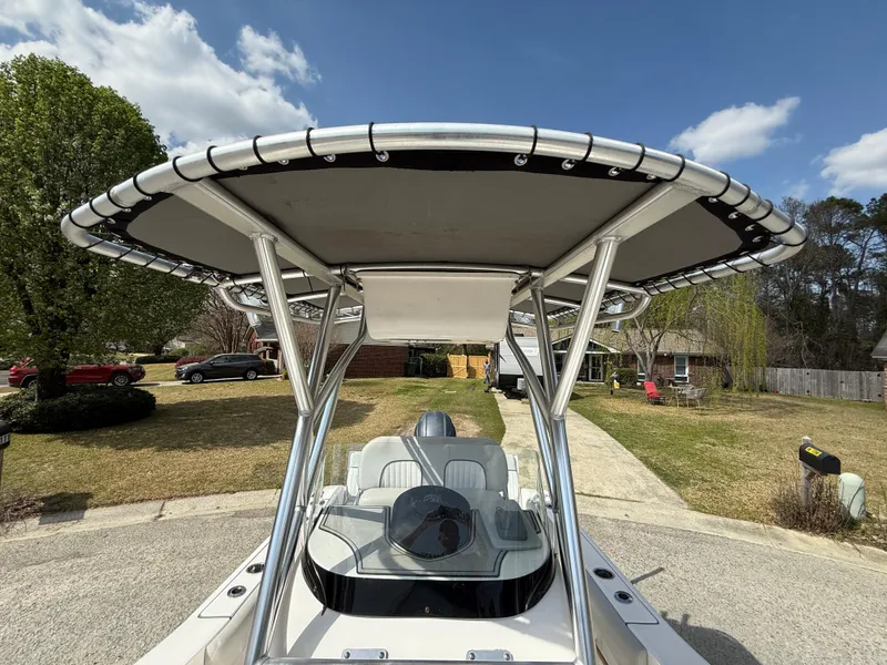 Slide: The Image of 2020 Sea Fox 206 Commander boat with T-top, parked in a suburban driveway. - 19
