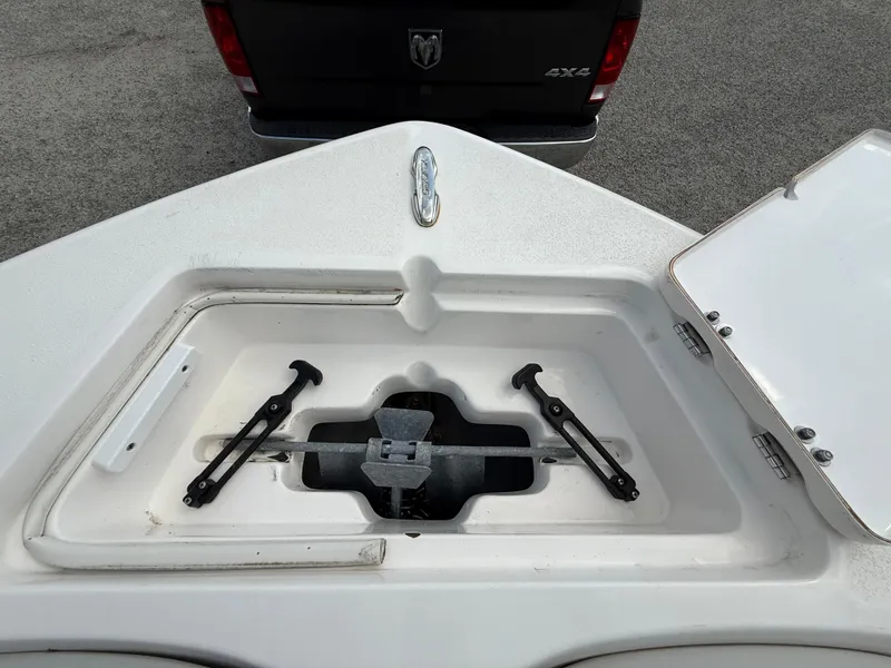 Slide: The Image of Anchor storage compartment on 2020 Sea Fox 206 Commander boat, open lid, parked vehicle in background. - 21