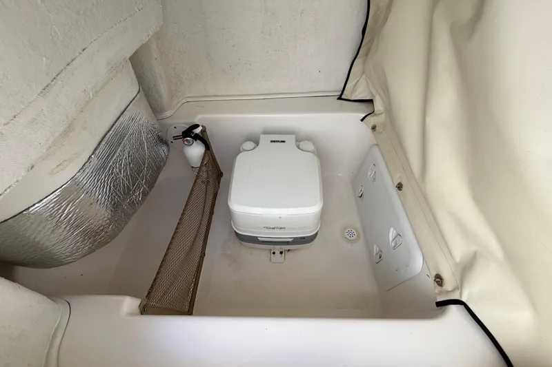 Slide: The Image of 2020 Sea Fox 206 Commander boat interior with portable toilet and storage net. - 22