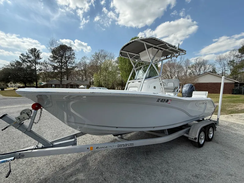 Slide: The Image of 2020 Sea Fox 206 Commander boat on trailer, parked outdoors under a partly cloudy sky. - 3