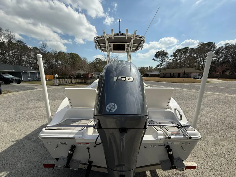 Slide: The Image of 2020 Sea Fox 206 Commander boat with 150 horsepower engine, parked outdoors under a blue sky. - 4