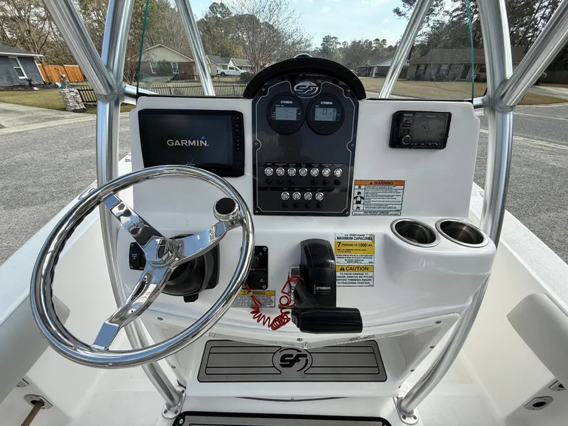 Slide: The Image of Center console of 2020 Sea Fox 206 Commander with Garmin display and steering wheel. - 8