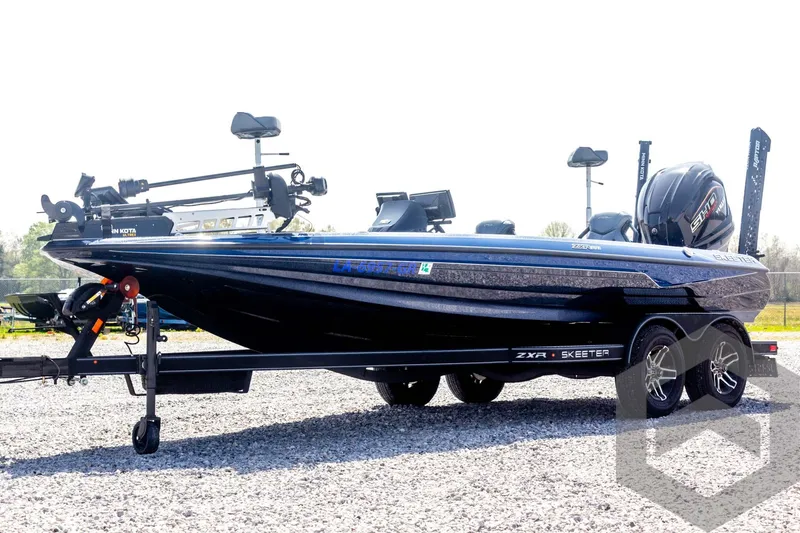 Slide: The Image of 2023 Skeeter ZXR 20 boat on trailer, side view, outdoors. - 1