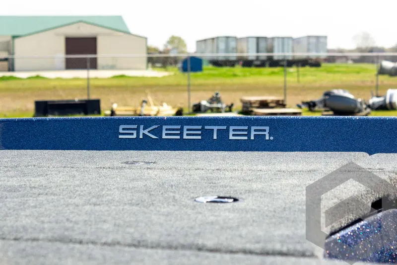 Slide: The Image of 2023 Skeeter ZXR 20 boat deck with logo, outdoor setting. - 10
