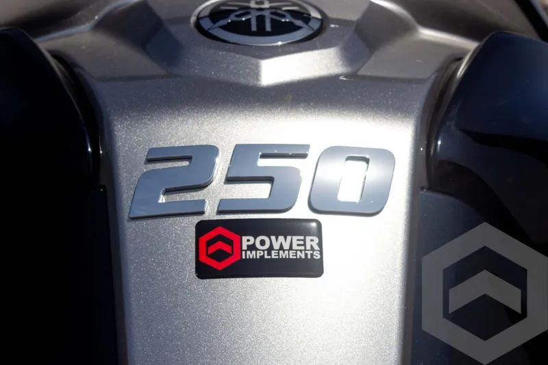 Slide: The Image of 2023 Skeeter ZXR 20 engine cover with "250" and "Power Implements" branding. - 13