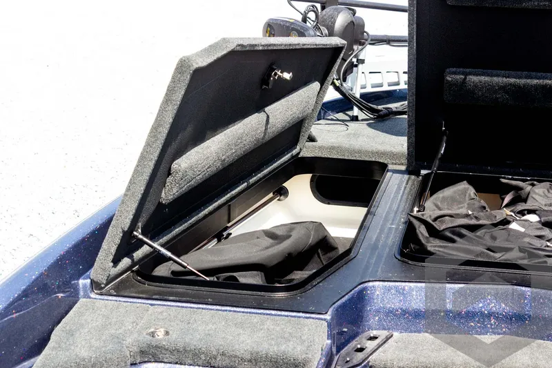 Slide: The Image of 2023 Skeeter ZXR 20 boat storage compartments open, showcasing interior space and design. - 22