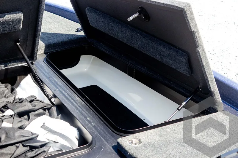 Slide: The Image of 2023 Skeeter ZXR 20 boat storage compartment with open lid and interior view. - 24