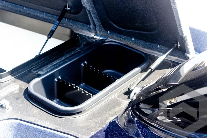 Slide: The Image of 2023 Skeeter ZXR 20 boat storage compartment with open lid. - 25