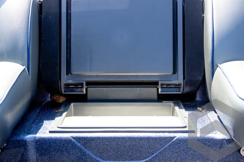 Slide: The Image of 2023 Skeeter ZXR 20 boat storage compartment with open lid, showcasing interior space. - 31