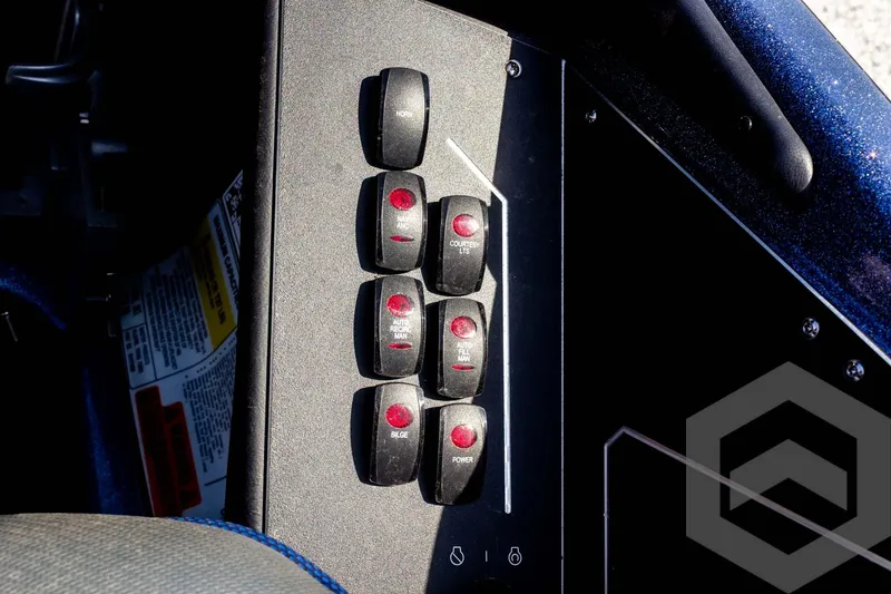 Slide: The Image of Control panel of 2023 Skeeter ZXR 20 boat with switches and indicators. - 34