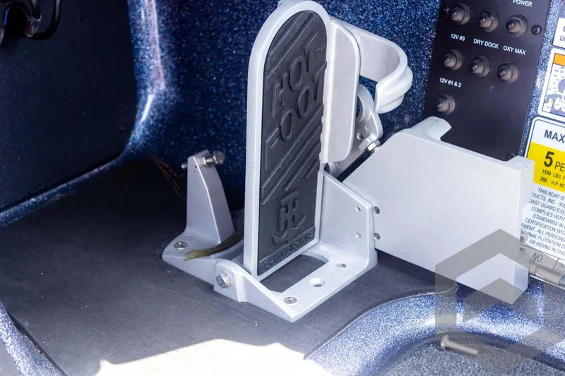 Slide: The Image of 2023 Skeeter ZXR 20 boat foot pedal and control panel close-up. - 35